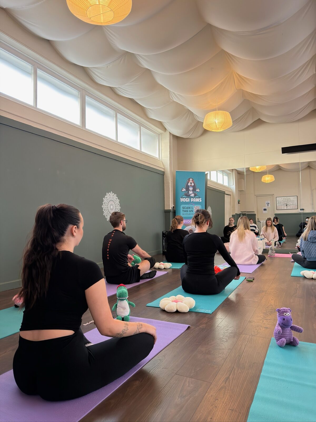 A Yogi Paws puppy yoga class in session
