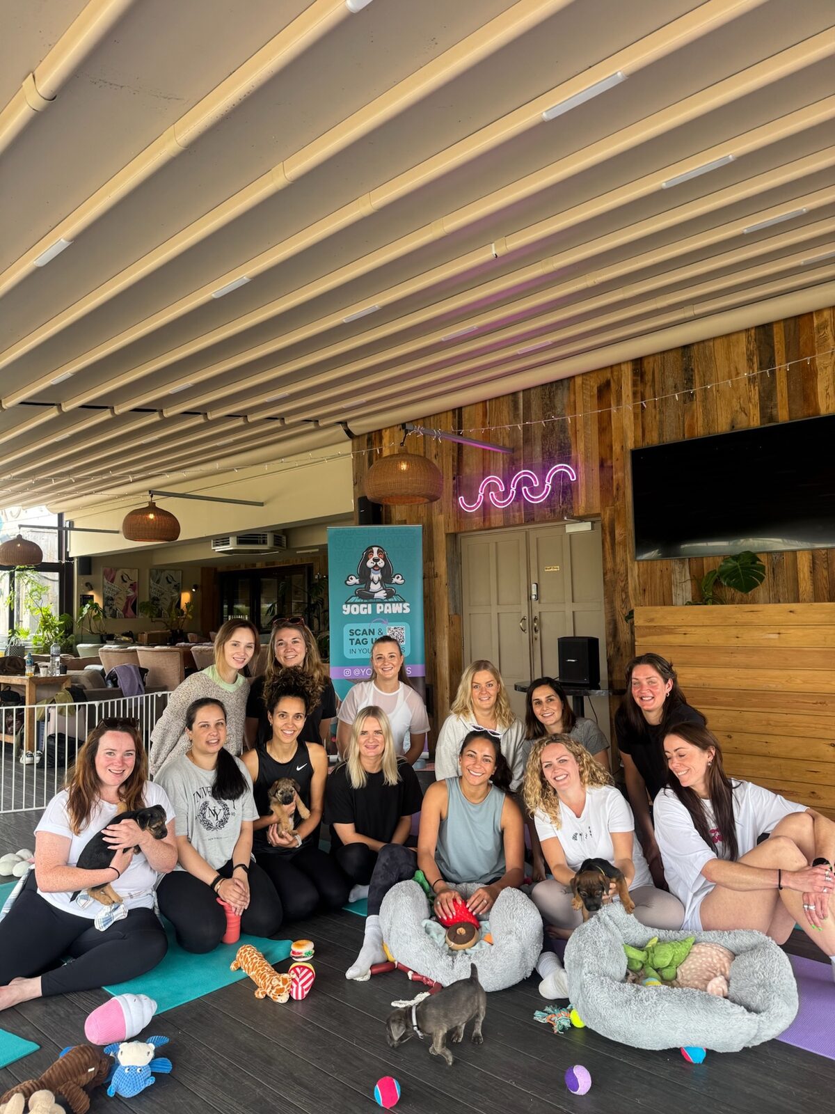 A group enjoying a Yogi Paws private hire